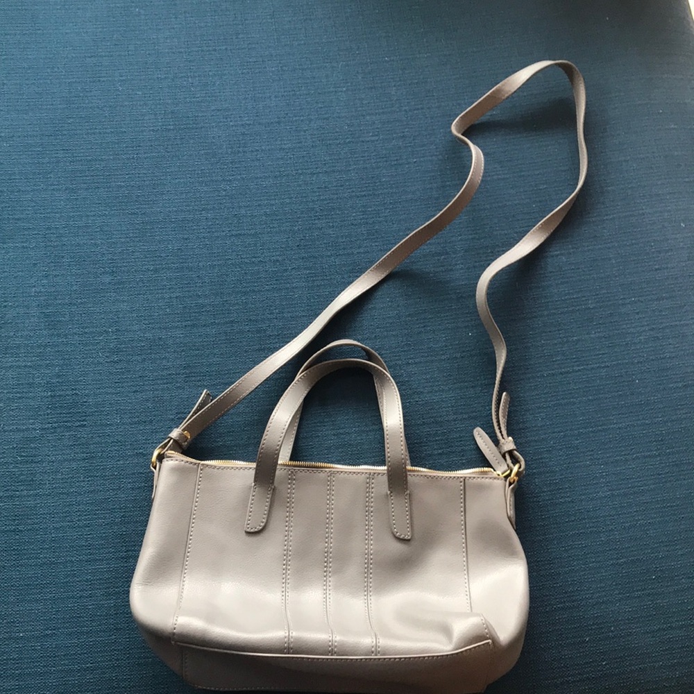 Handbag with over body strap